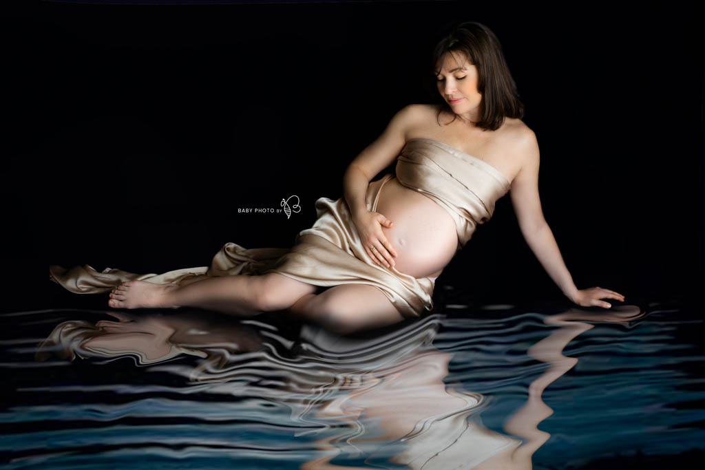 pregnant lady posing as mermaid