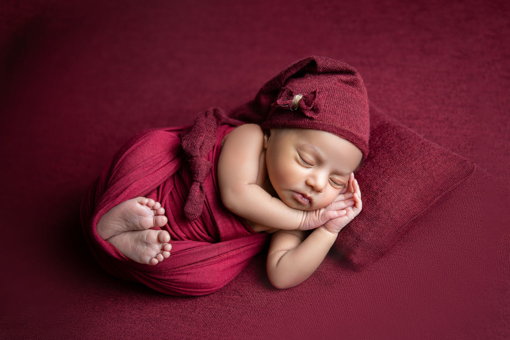 newborn baby girl in red