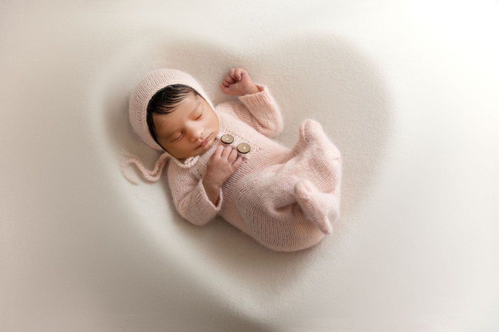 newborn baby in heart shape